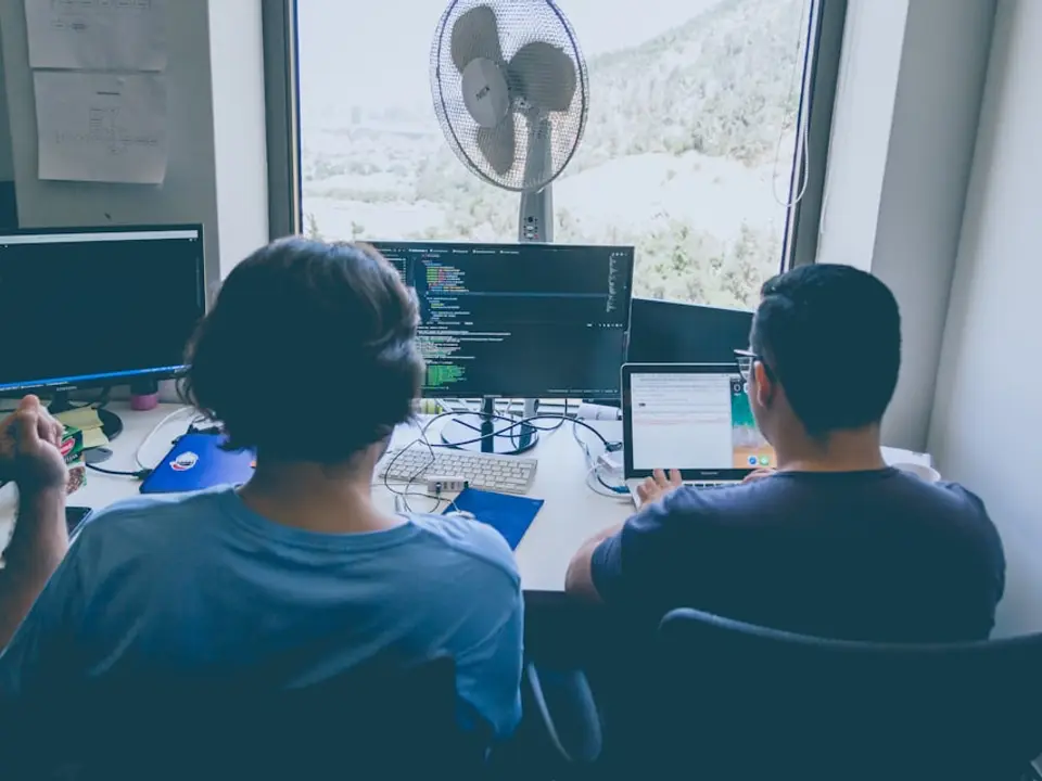 Operators collaborating at computers