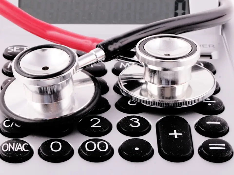 Stethoscope on a calculator for billing ops