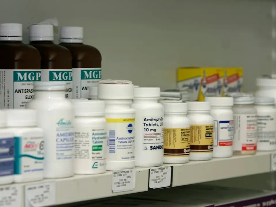 Pharmacy shelves with medication packages