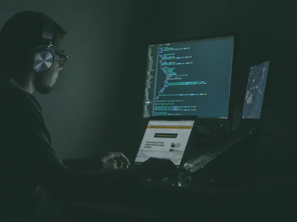 Person using laptop computers for software work