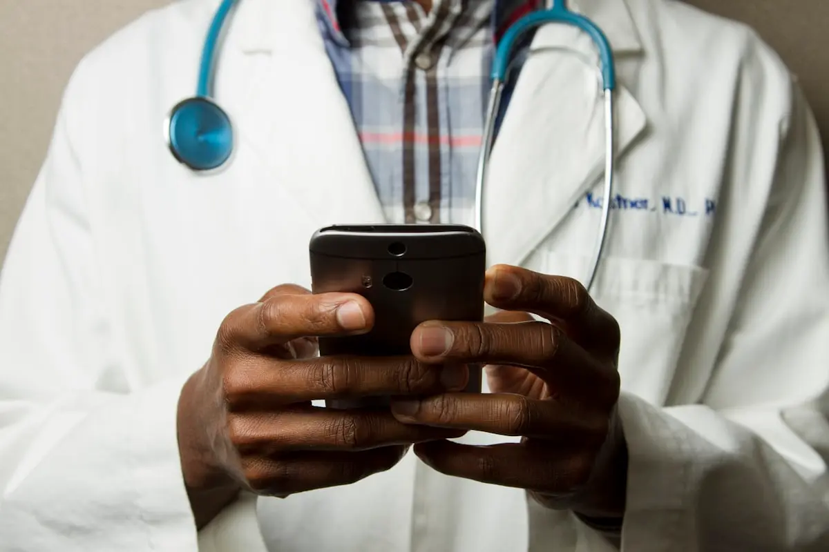 Clinician reviewing records on a tablet in a clinic